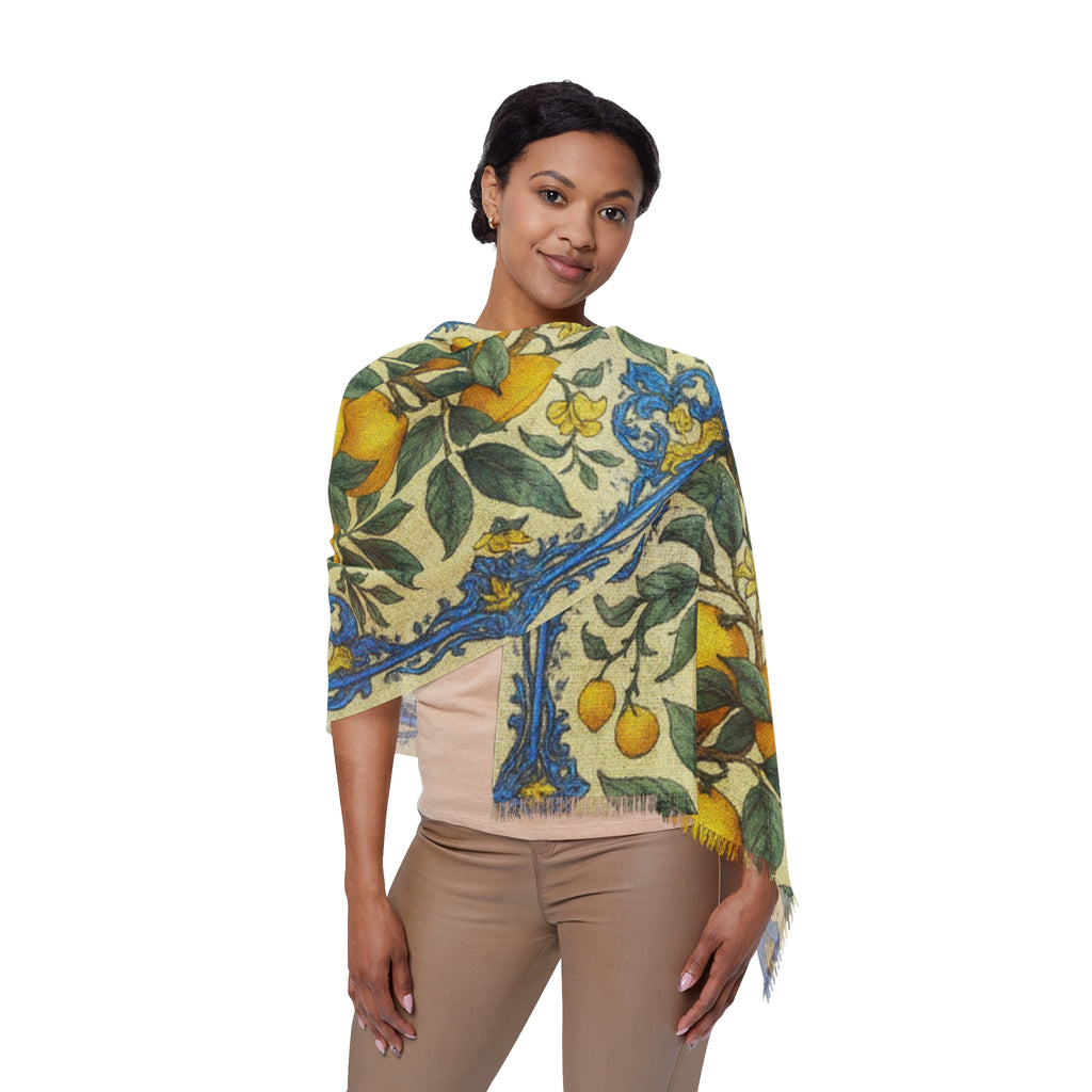 A woman wearing a lightweight scarf with a vintage lemon and blue tile print, draped over her shoulders against a white background.