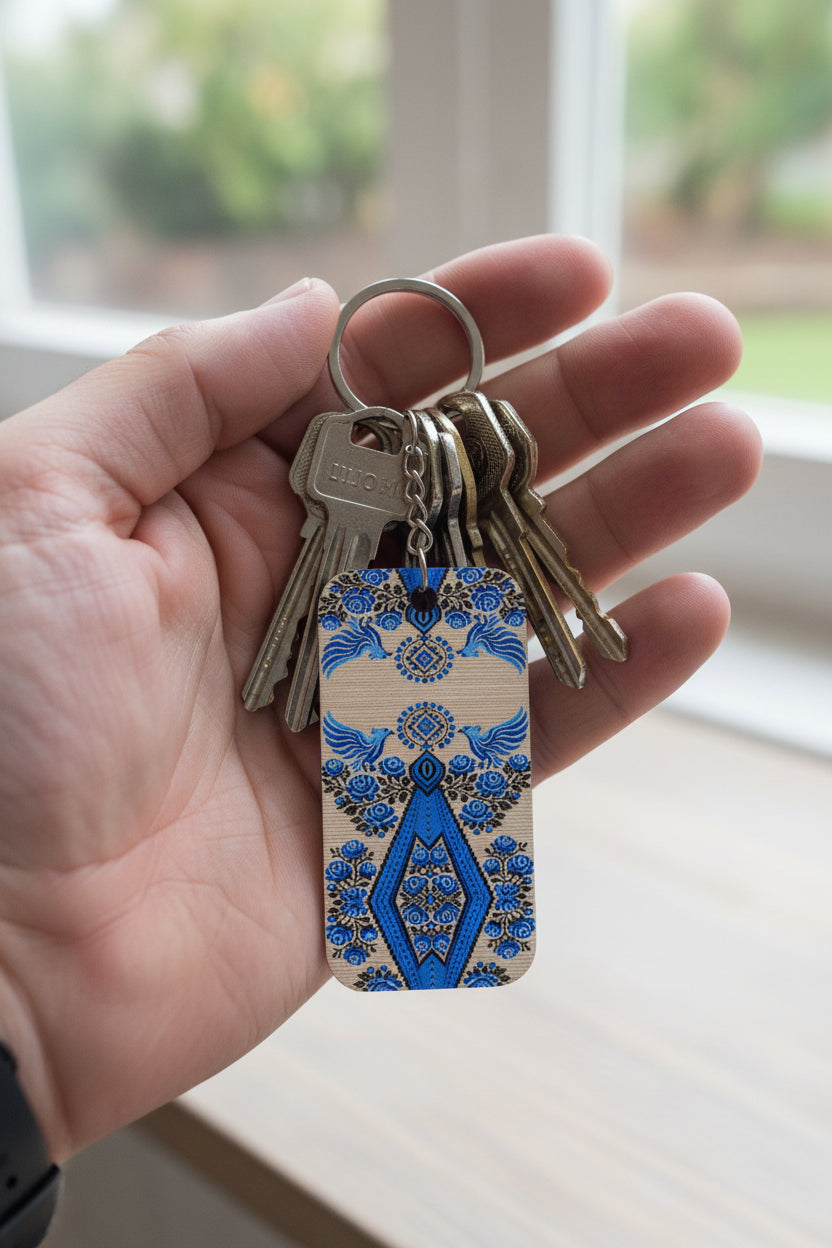 Ukrainian Berehynia keychain with blue black geometric folk art pattern
