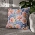 Square floral pillowcase from the Soft Provence collection featuring pink peonies and blue hydrangeas on a textured blue background with a concealed zipper.