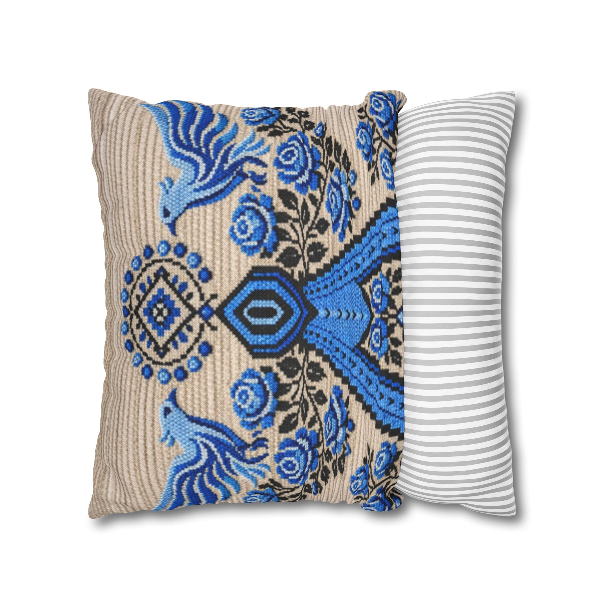 Ukrainian Berehynia throw pillow with blue black folk art pattern on sofa
