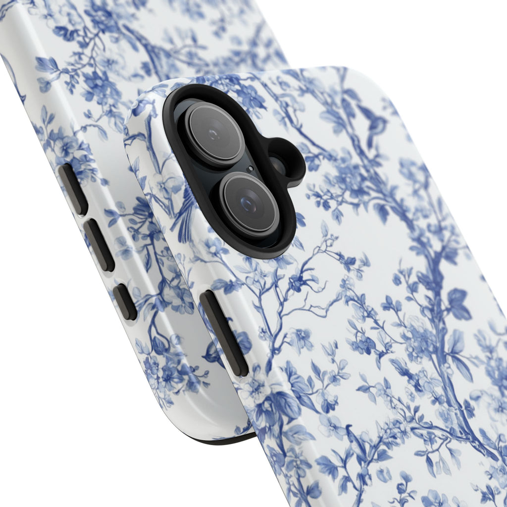 Blue floral toile phone case with vintage porcelain-style delicate birds and branches pattern — classic blue and white botanical design, dual-layer shockproof iPhone cover with glossy finish

