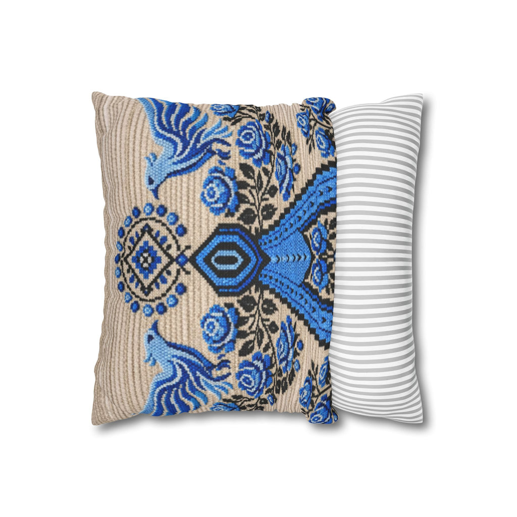 Ukrainian Berehynia throw pillow with blue black folk art pattern on sofa
