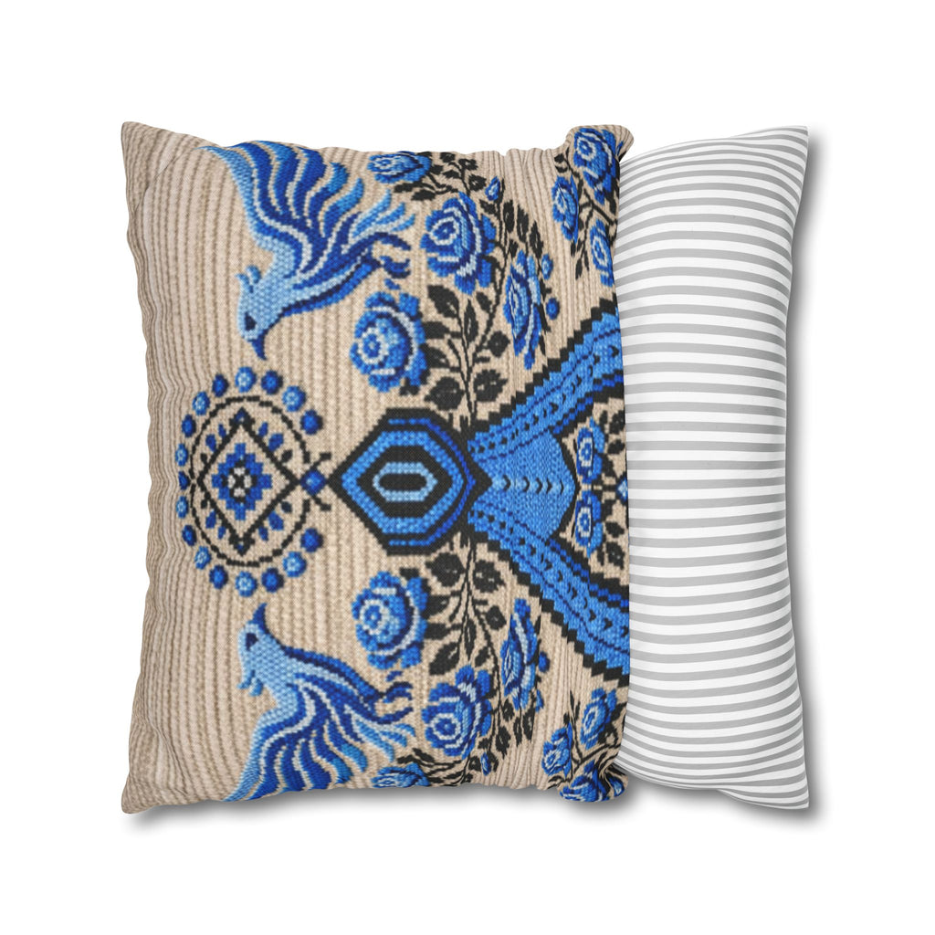 Ukrainian Berehynia throw pillow with blue black folk art pattern on sofa
