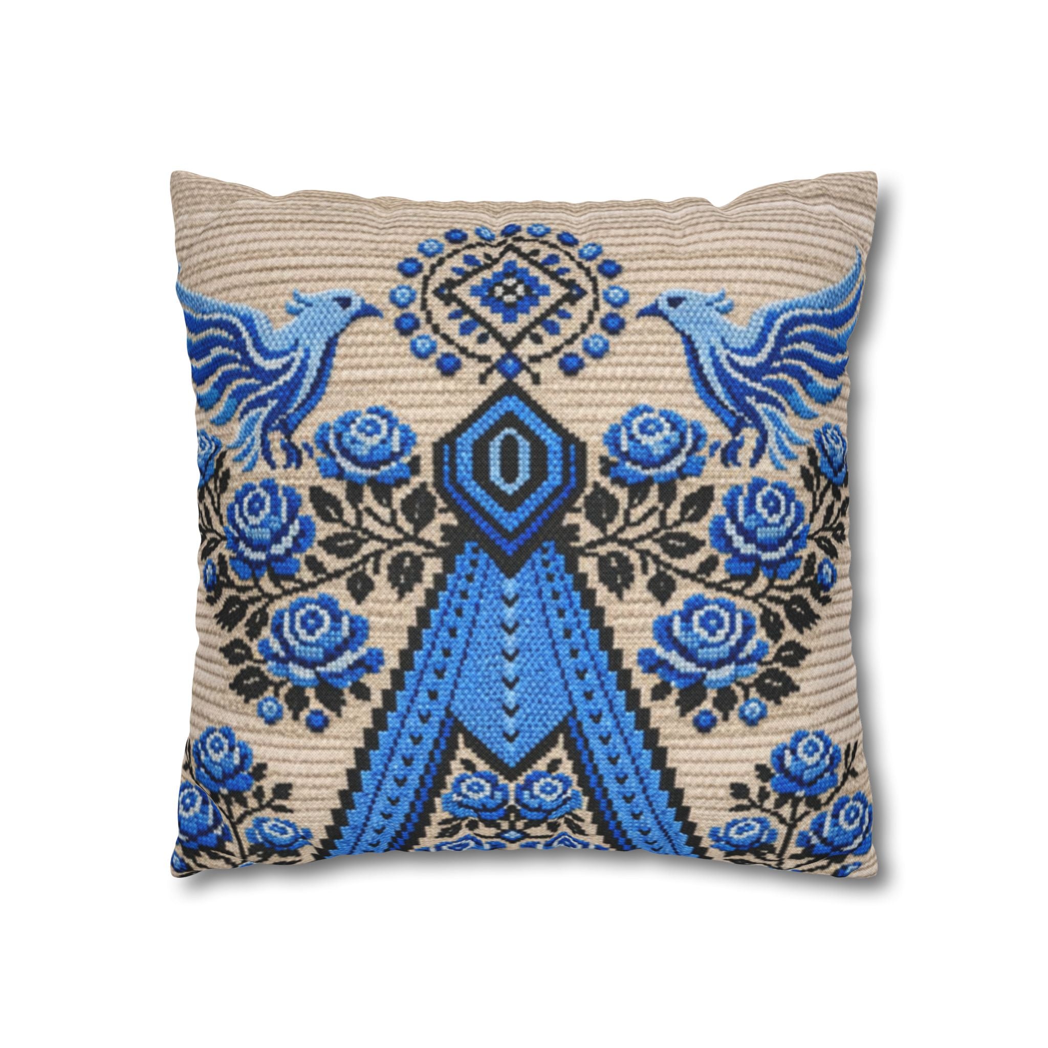 Ukrainian Berehynia throw pillow with blue black folk art pattern on sofa
