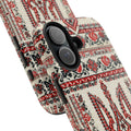 Tryzub Ukrainian phone case with red and black folk embroidery — iconic Ukrainian trident national symbol surrounded by traditional cross-stitch motifs, dual-layer shockproof iPhone cover

