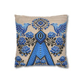 Ukrainian Berehynia throw pillow with blue black folk art pattern on sofa
