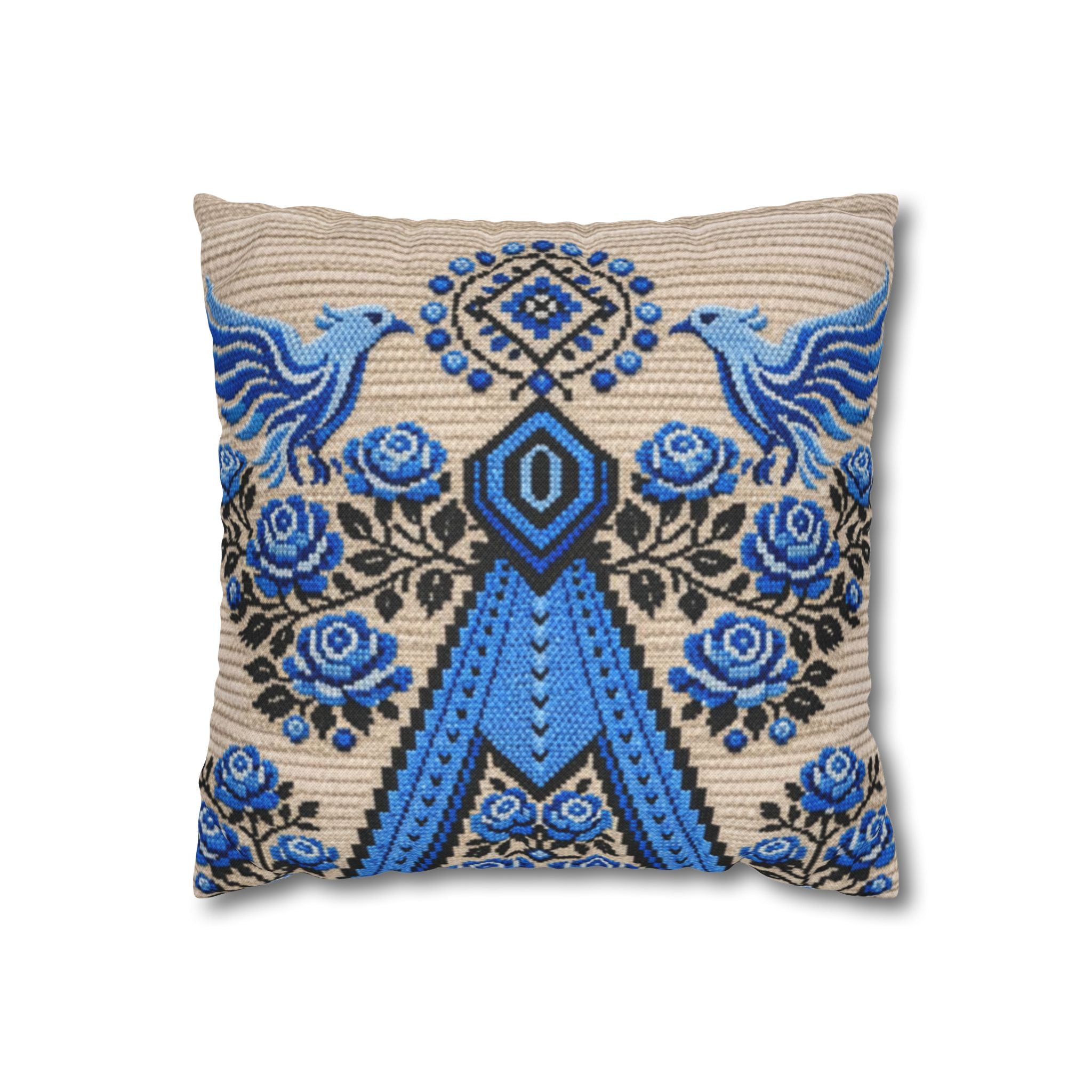 Ukrainian Berehynia throw pillow with blue black folk art pattern on sofa
