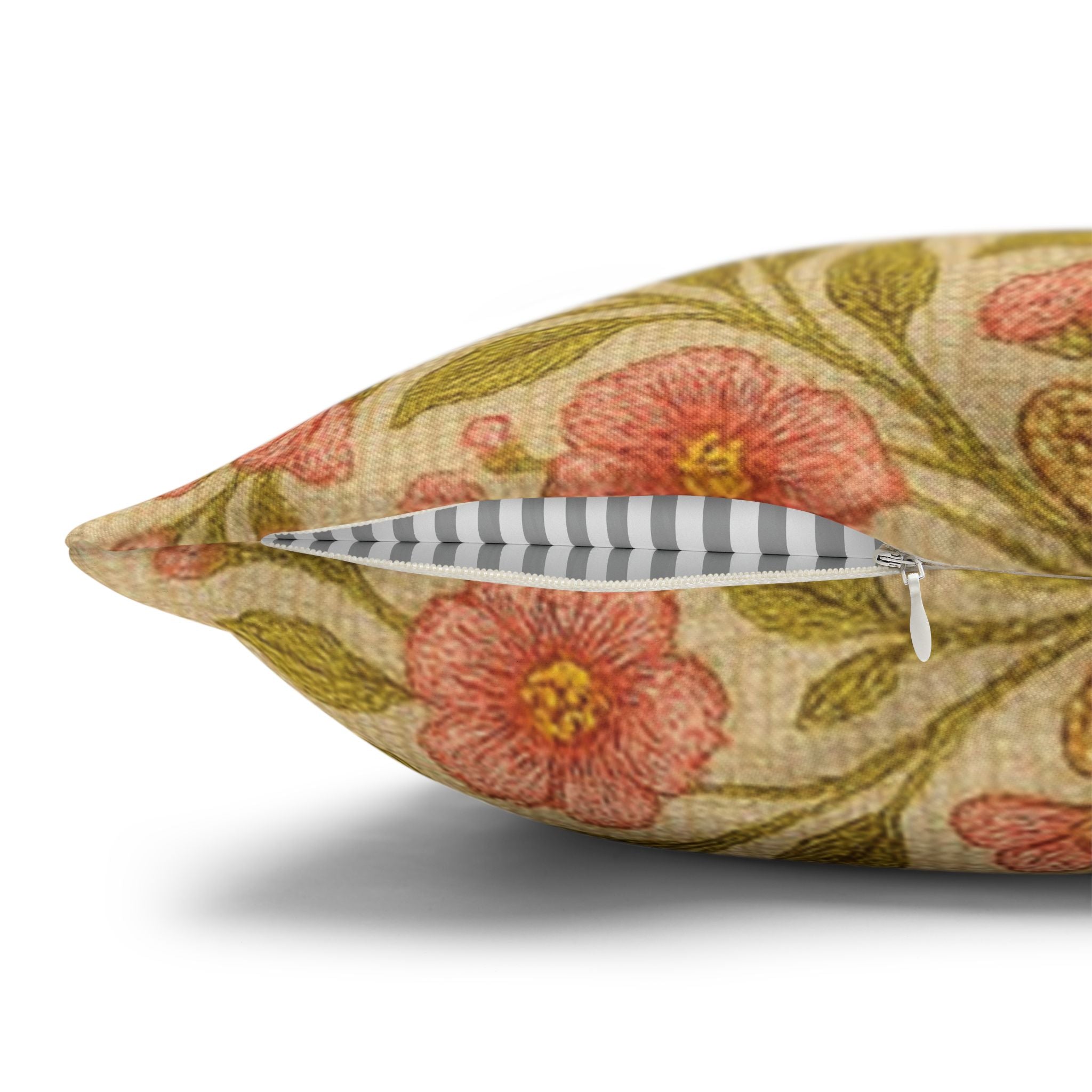 Blessed Home Collection throw pillow with a floral cross and pink rose design on a gray textured sofa.