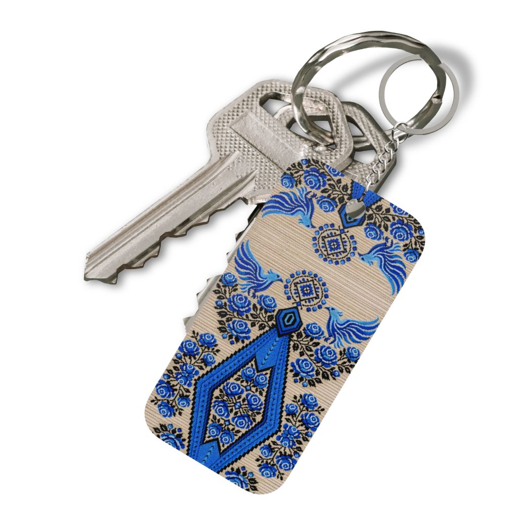 Ukrainian Berehynia keychain with blue black geometric folk art pattern
