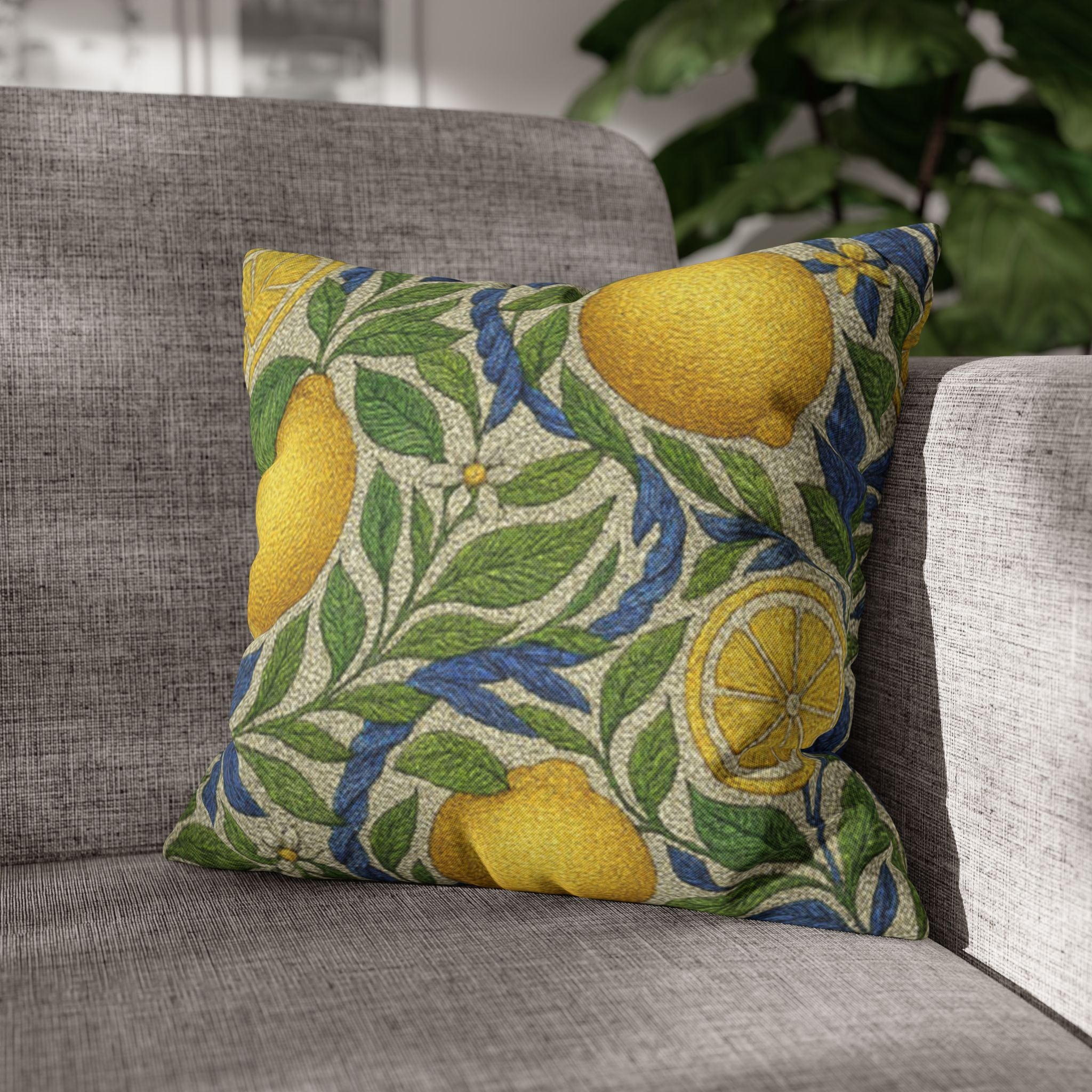 Square decorative pillowcase featuring a vintage botanical pattern of yellow lemons and blue flowers on a textured beige background, isolated on white.