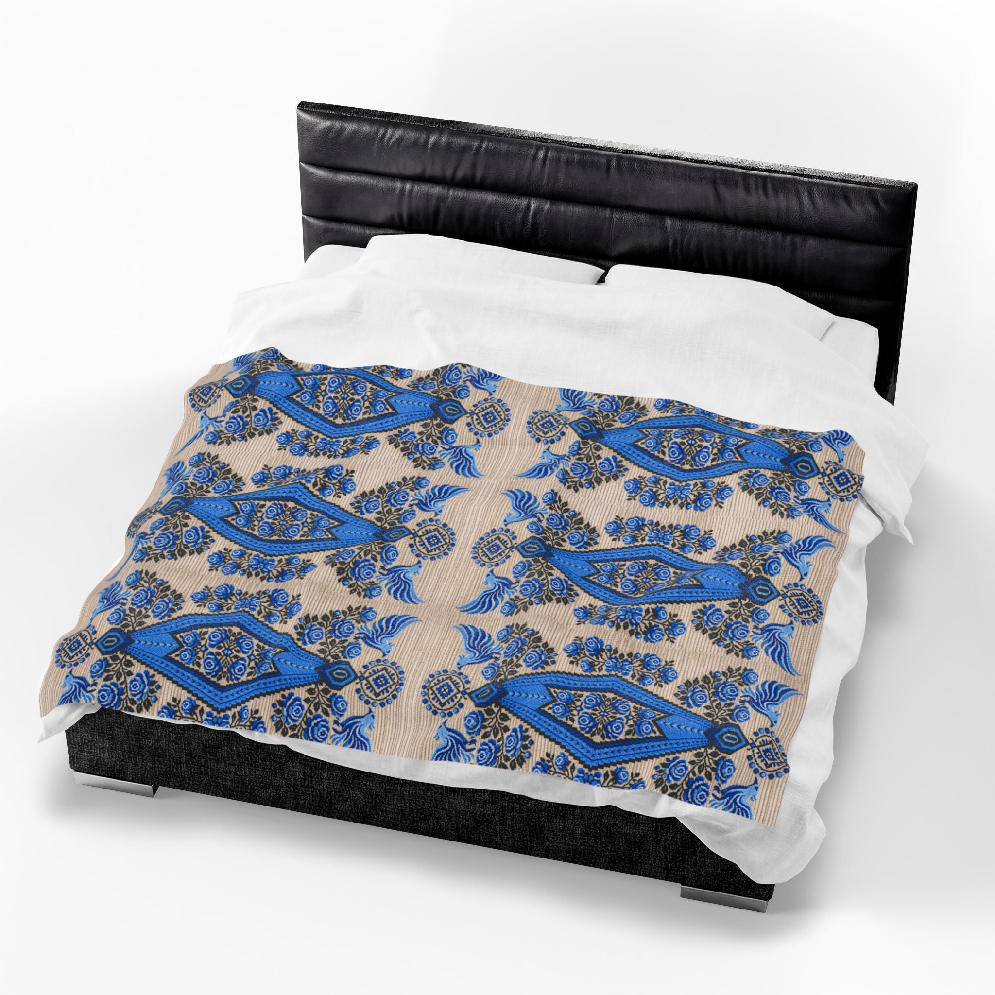Ukrainian Berehynia blanket with blue black folk art geometric pattern on bed
