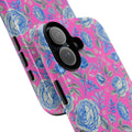 Close-up of a dual-layer tough phone case featuring a vibrant pink and blue rose floral pattern with a black camera lens protector.