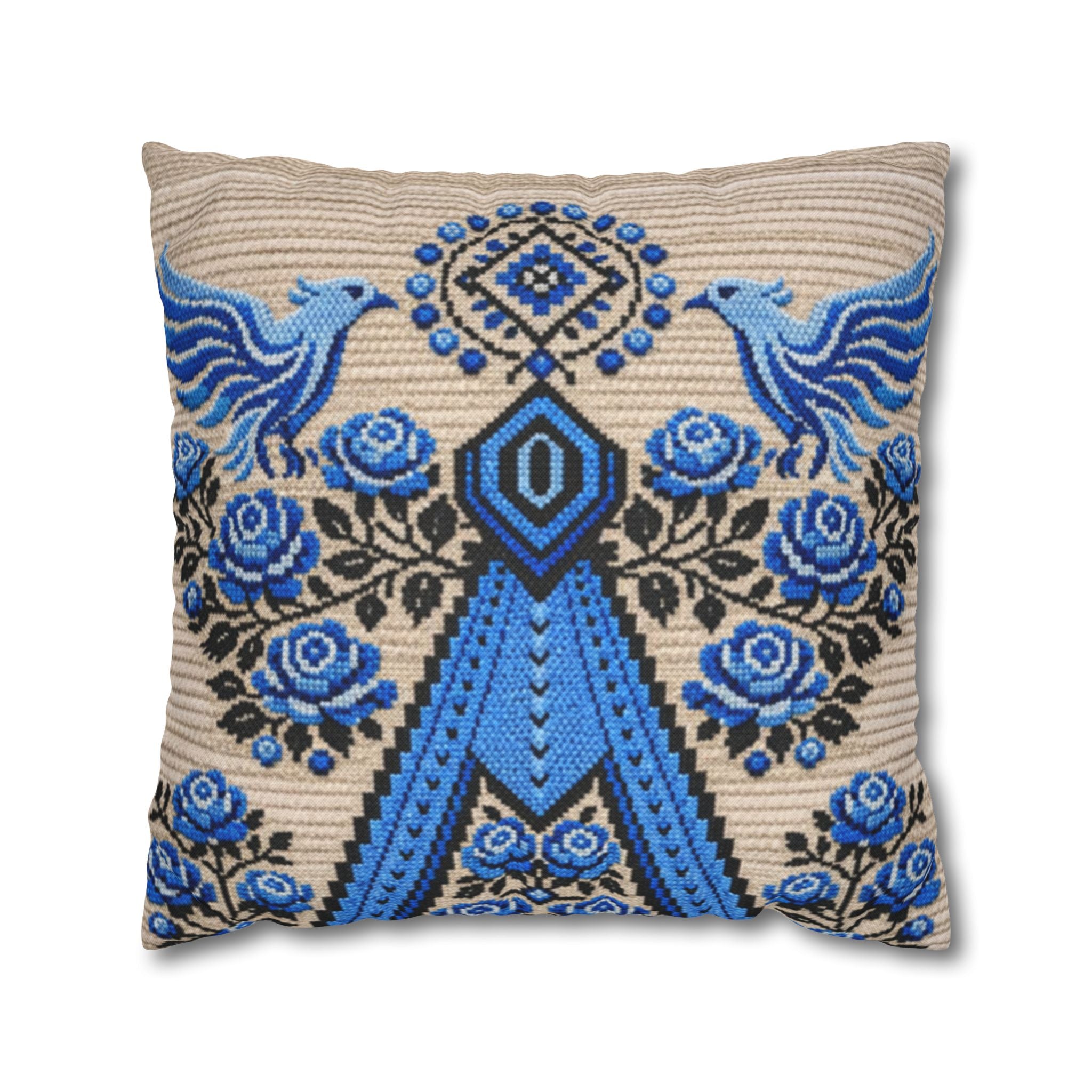 Ukrainian Berehynia throw pillow with blue black folk art pattern on sofa
