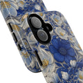 Durable two-layer phone case with a rich blue and white floral pattern from the Denim Soul Collection, showing the camera cutout and side buttons.