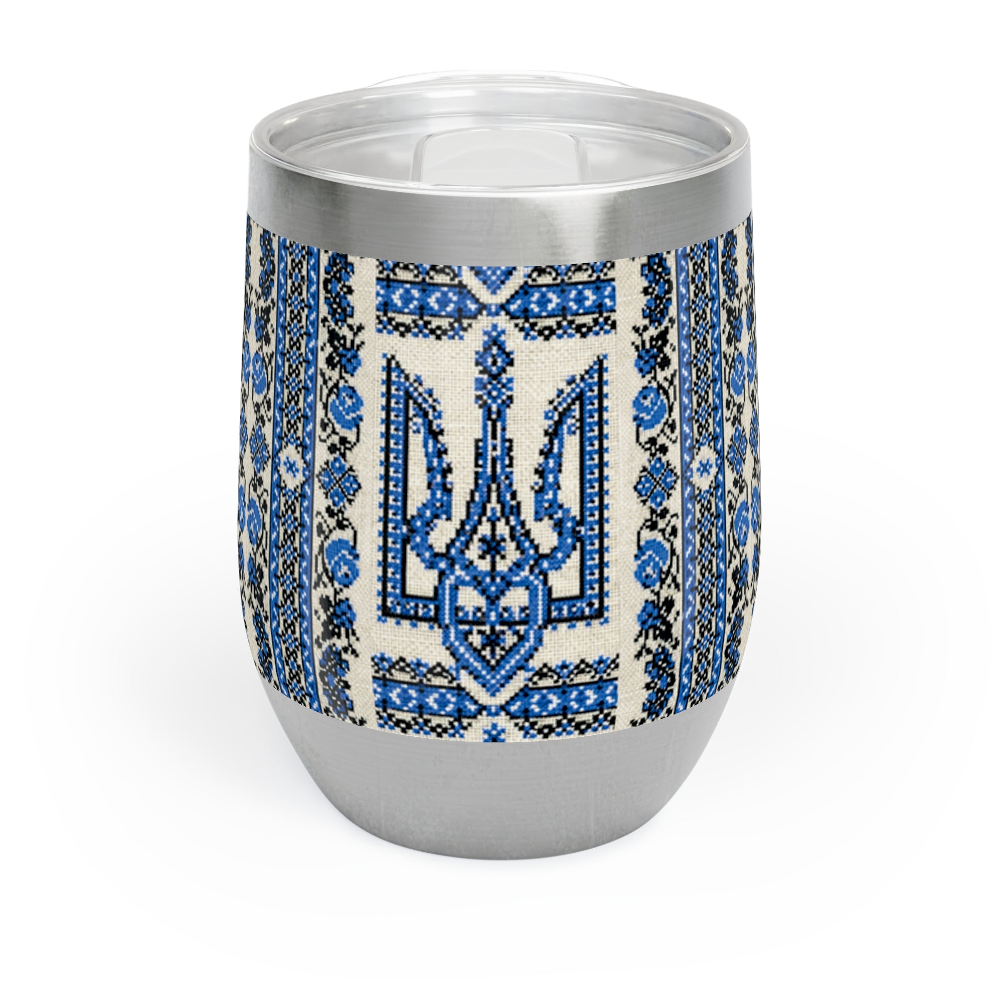 A 12oz stainless steel stemless wine tumbler with a white finish. The middle section is wrapped in a vibrant blue and black Ukrainian Trident (Tryzub) pattern with traditional folk floral embroidery details. It has a clear plastic lid with a slide opening.