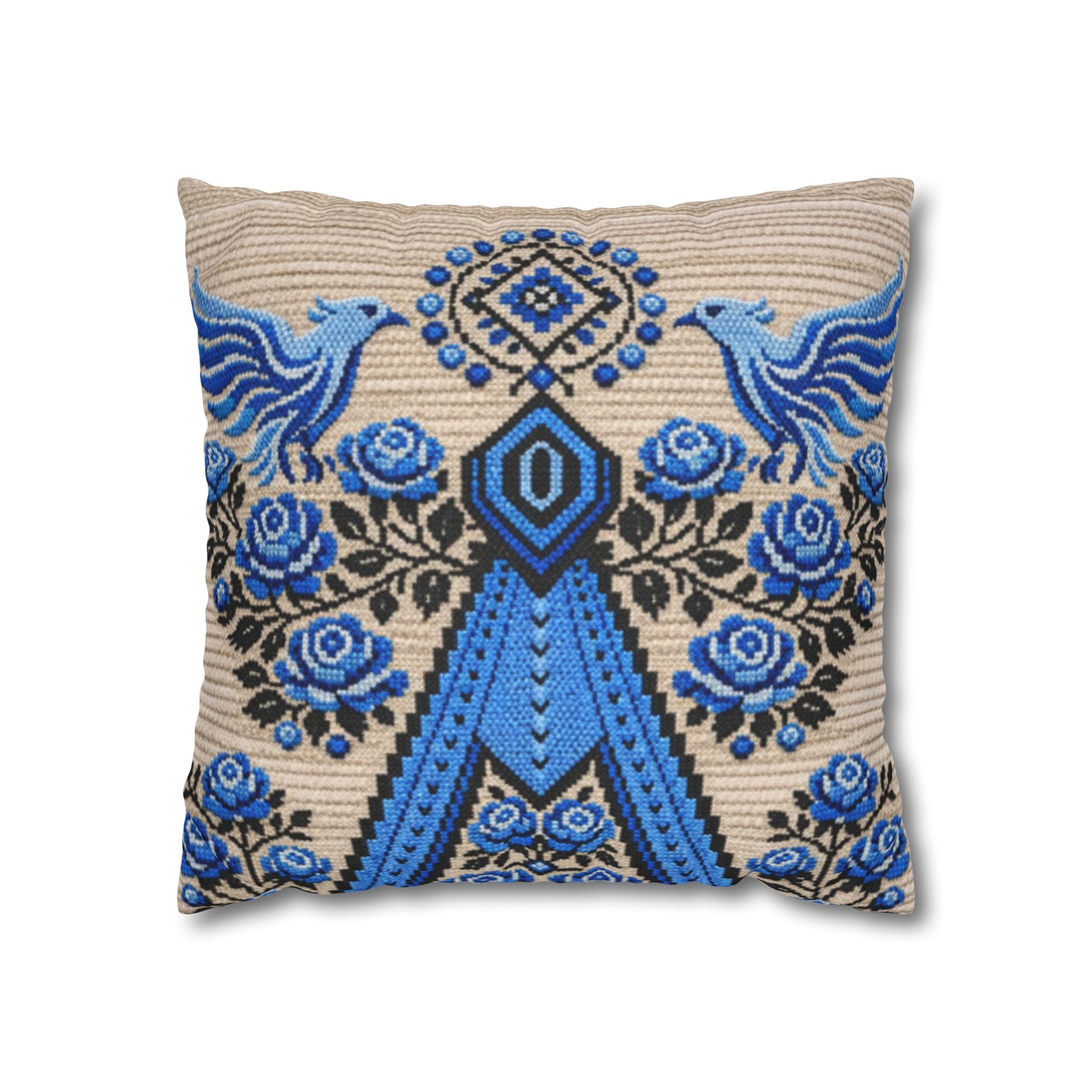 Ukrainian Berehynia throw pillow with blue black folk art pattern on sofa
