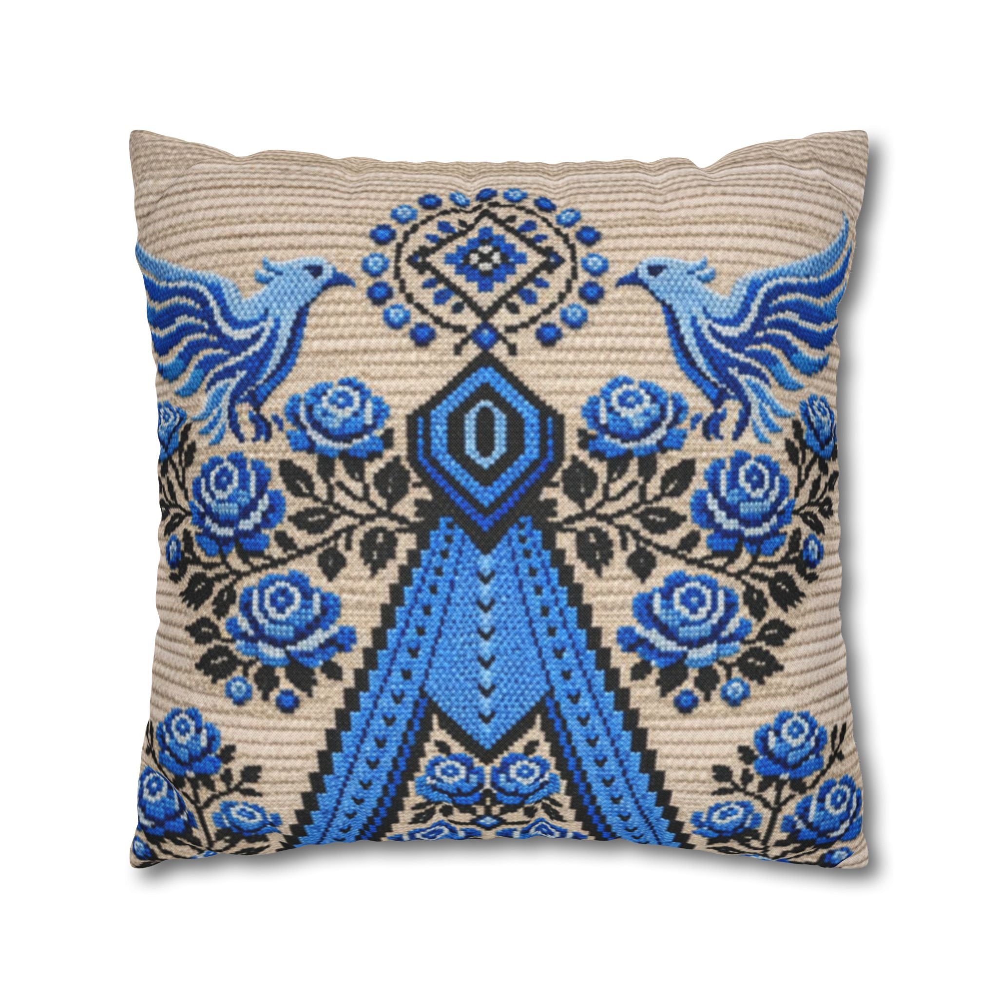 Ukrainian Berehynia throw pillow with blue black folk art pattern on sofa

