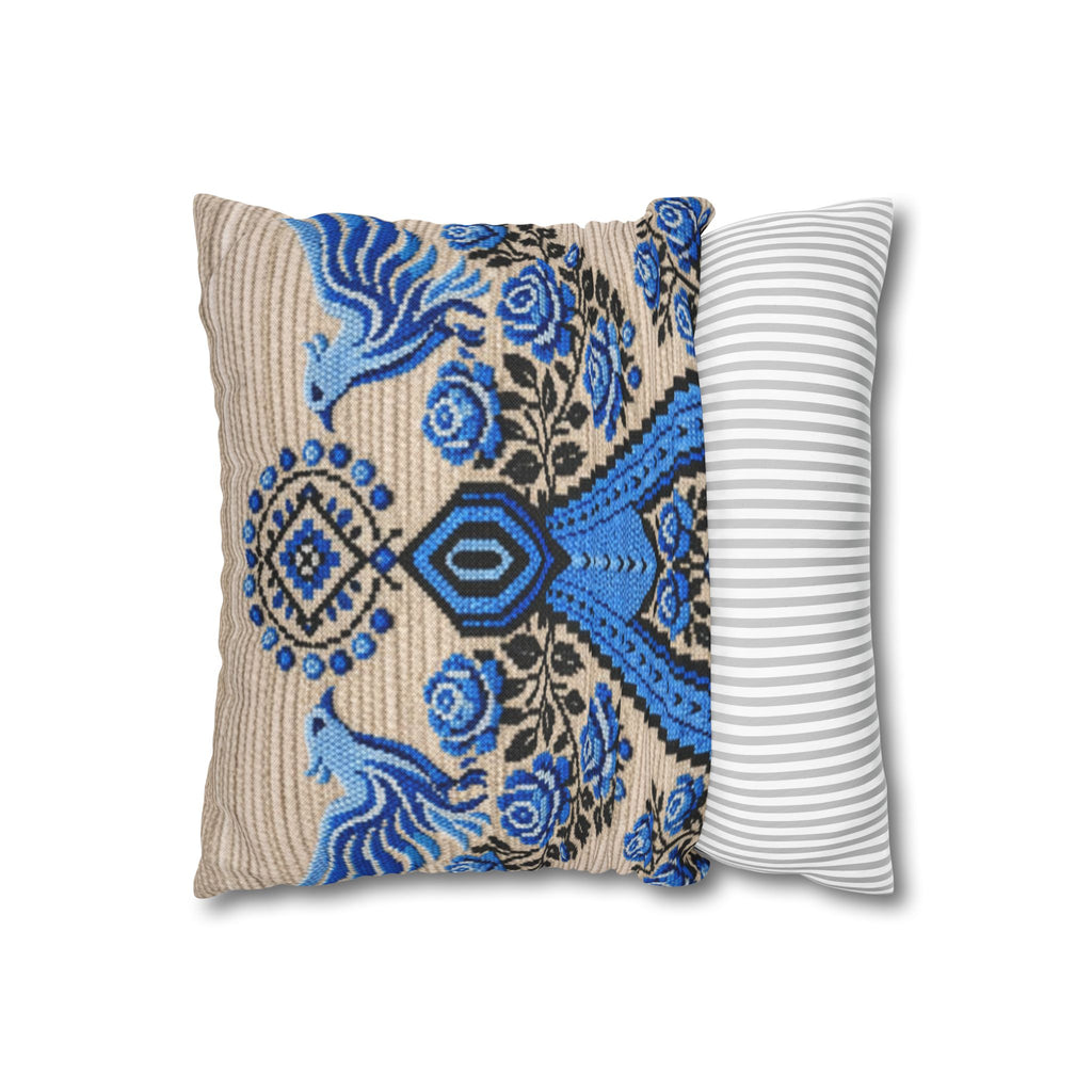 Ukrainian Berehynia throw pillow with blue black folk art pattern on sofa
