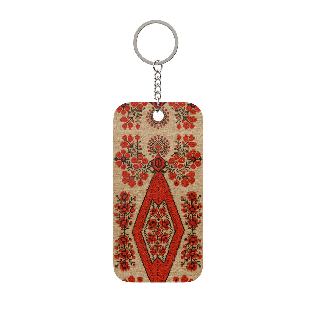 Ukrainian Berehynia keychain with red floral folk art pattern
